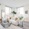 a living room with a white couch and a table
