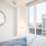 a bedroom with a large window